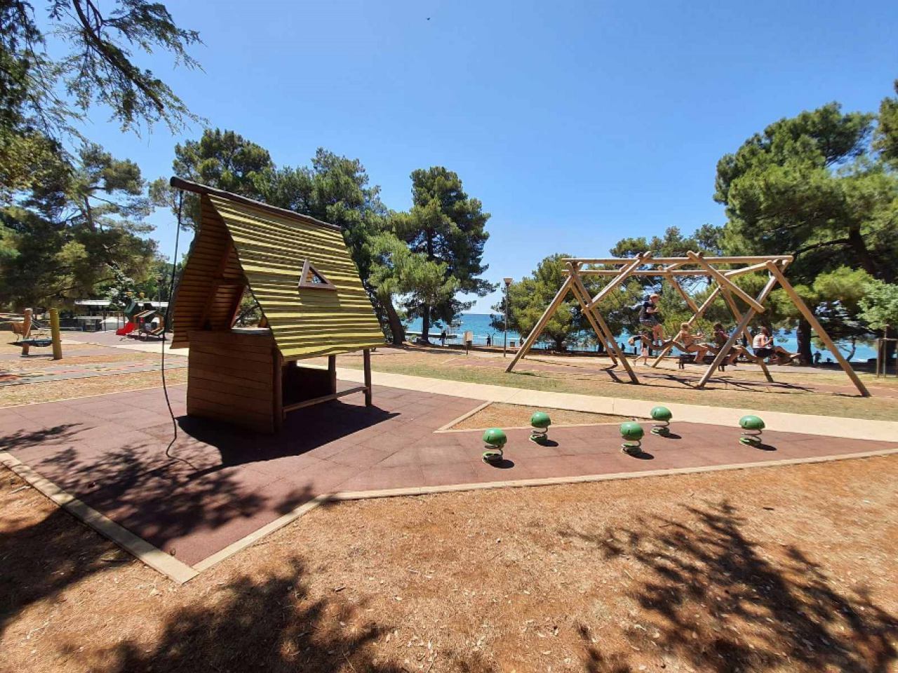 Restaurant and playground in the shade Poreč